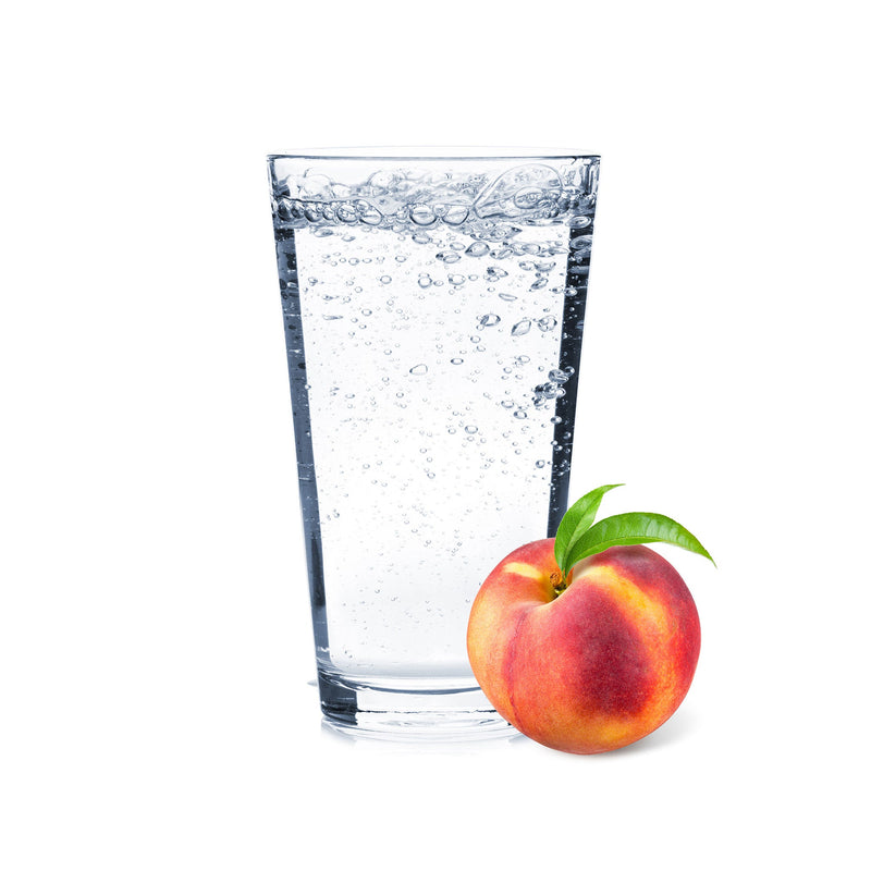 A glass of Peach Hard Seltzer with peach slices next to it.